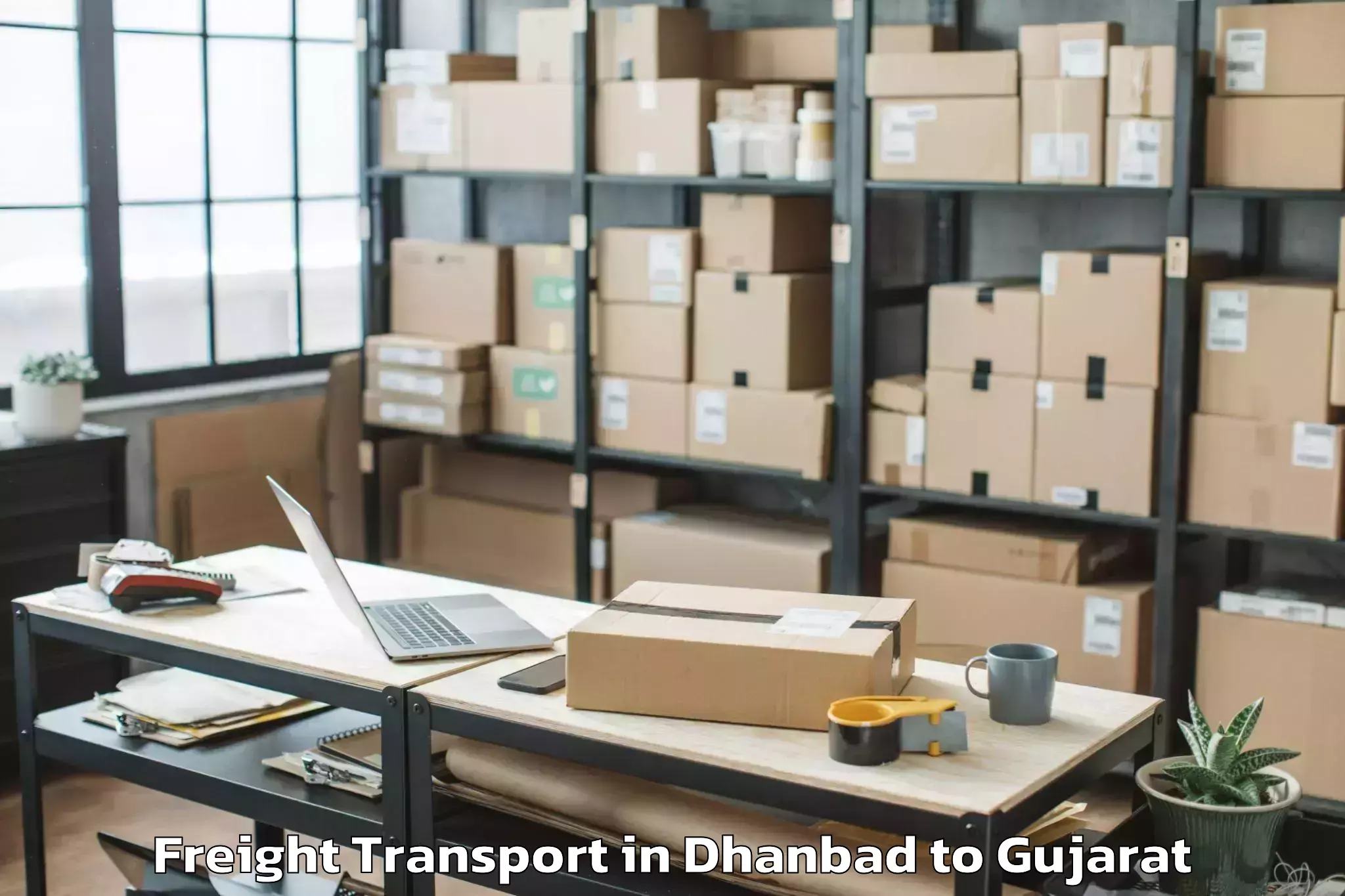 Book Dhanbad to Gussar Freight Transport